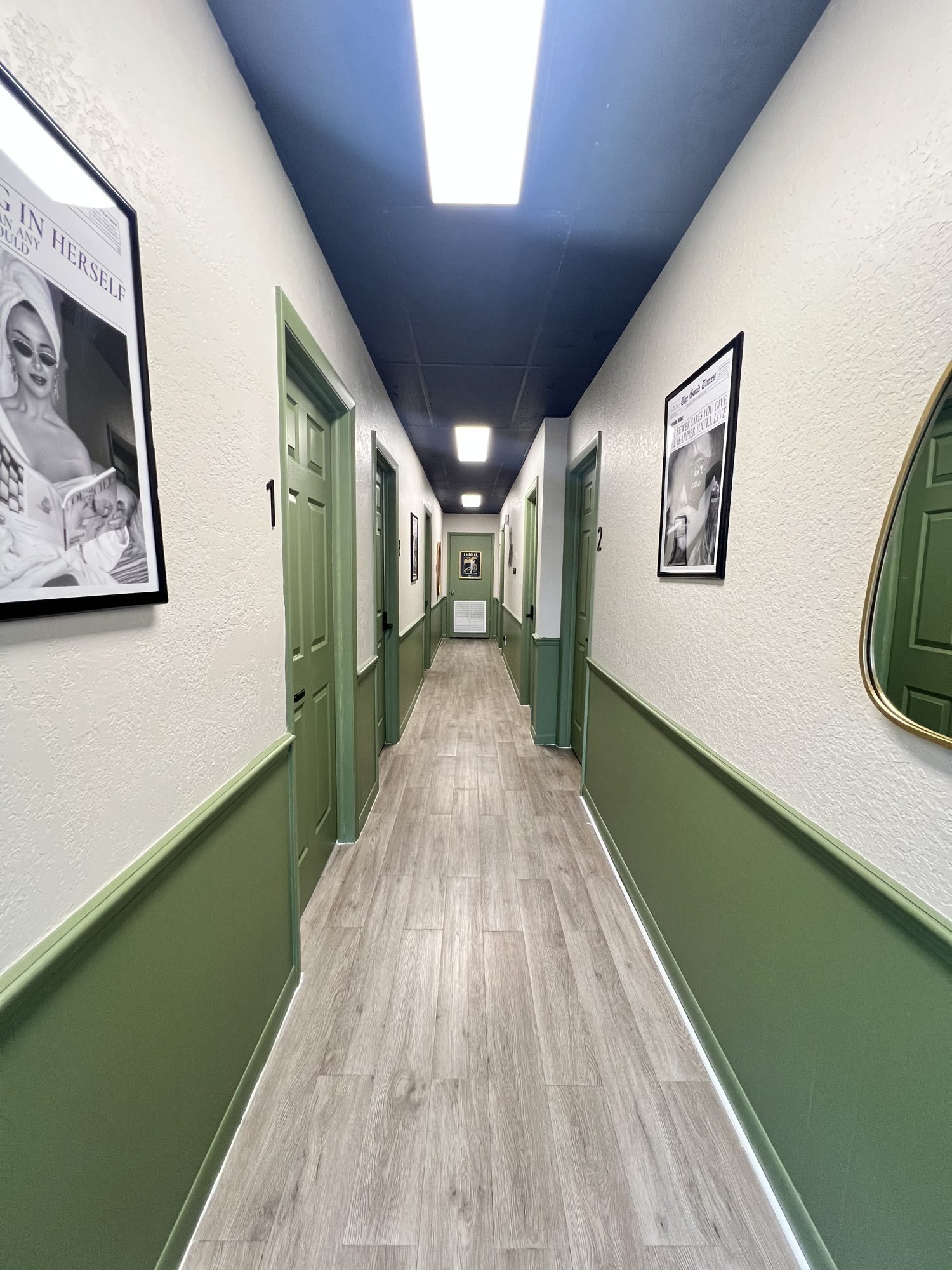 Salon suites hallway with green doors